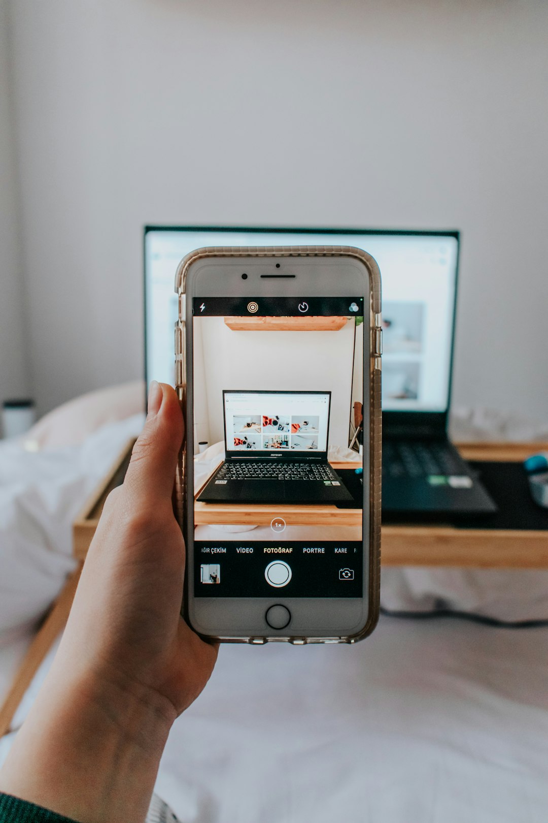 person-holding-silver-iphone-6-azo0u8kh3oo