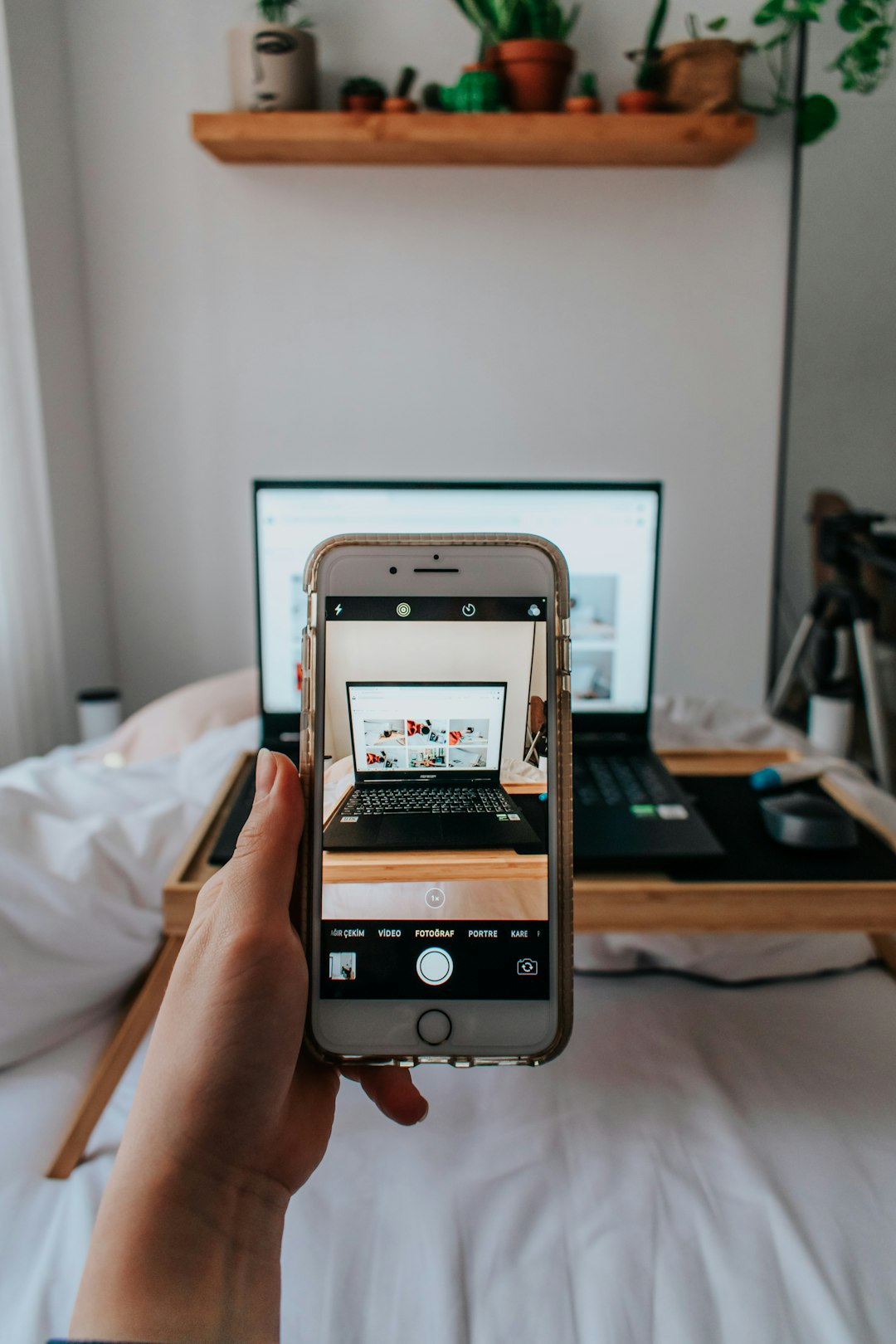 person-holding-silver-iphone-6-yyvgp8pilcw